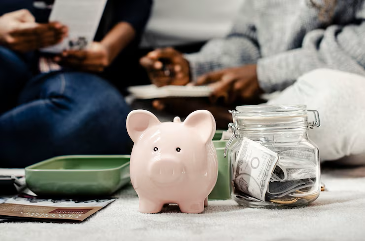 mother teaching her daughter about savings
